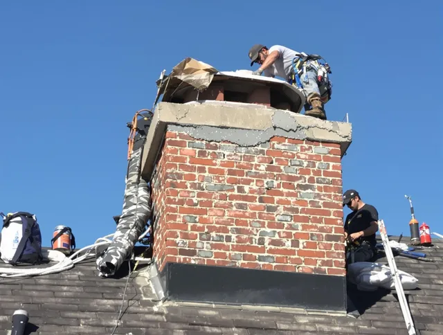 San Juan Capistrano Chimney Sweep installing a custom chimney crown in San Juan Capistrano, CA