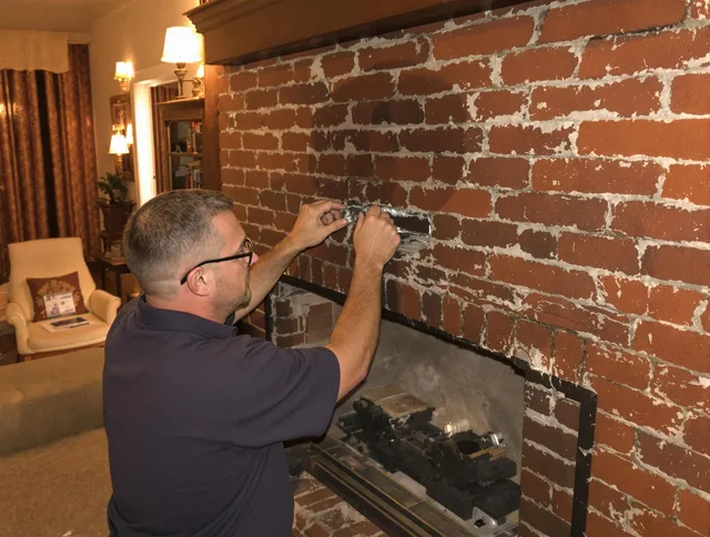 San Juan Capistrano Chimney Sweep expert fixing a fireplace in San Juan Capistrano, CA